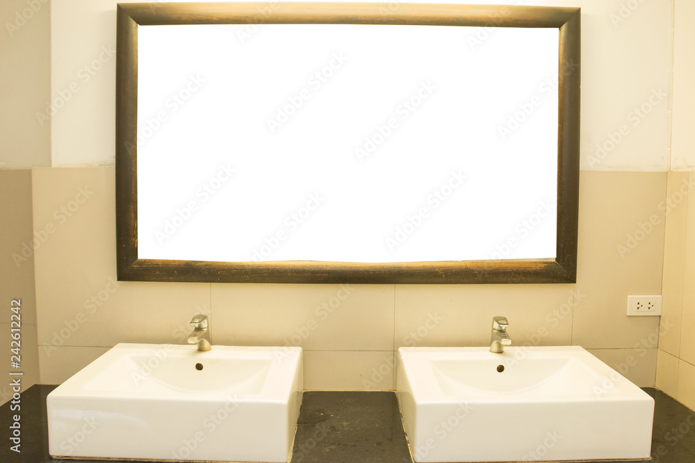 That washes hands in the bathroom and has a mirror