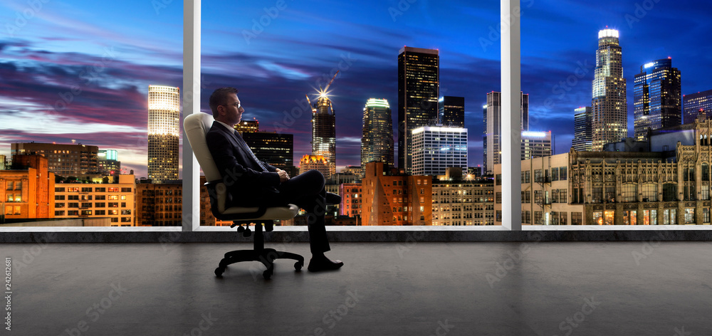 Businessman in an empty office for a startup or failure and bankruptcy in city of LA - obrazy, fototapety, plakaty 