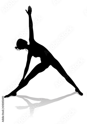 A silhouette of a woman in a yoga or pilates pose 