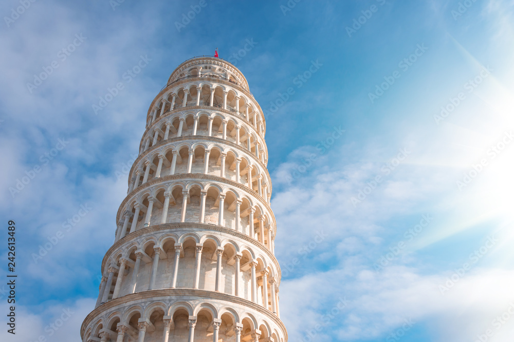The Leaning Tower of Pisa, Italy, against the background of a beautiful day sky