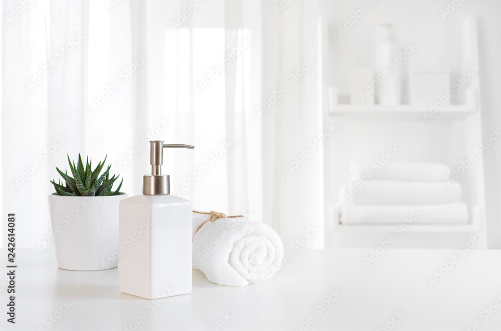 Ceramic soap, towel, copy space on blurred white spa background Ceramic soap, towel, copy space on blurred white spa background