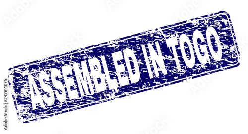 ASSEMBLED IN TOGO stamp seal print with grunge style. Seal shape is a rounded rectangle with frame. Blue vector rubber print of ASSEMBLED IN TOGO label with grunge texture.
