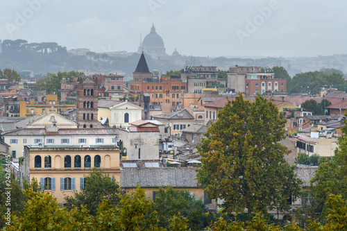 View on Rome from Orange Garden, Giardino degli Aranci on Aventine hill in rain. Italy photo