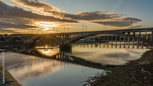 Fototapeta Naklejka Na Ścianę i Meble -  Royal Tweed Bridge and Royal Border bridge in the background, leading over the River Tweed in Berwick-Upon-Tweed, Northumberland, England, UK
