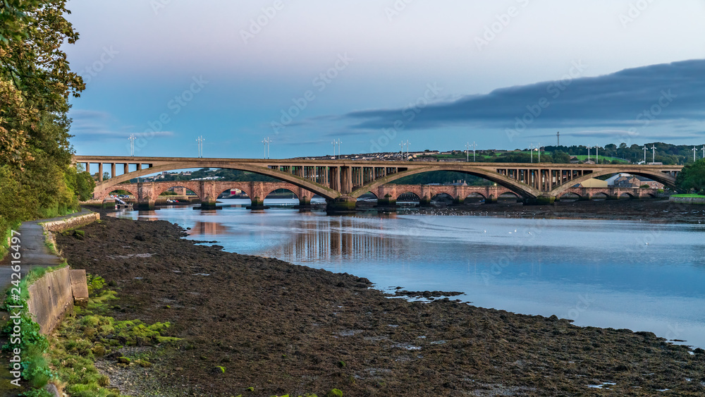 Royal Tweed Bridge and Berwick Bridge in the background, leading over the River Tweed in Berwick-Upon-Tweed, Northumberland, England, UK Royal Tweed Bridge and Berwick Bridge in the background, leading over the River Tweed in Berwick-Upon-Tweed, Northumberland, England, UK