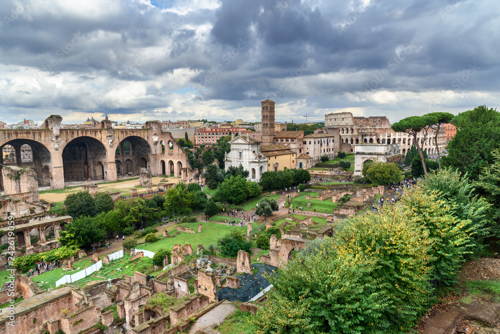 Ruins of Roman Forum. Temple of Antoninus and Faustina, basilica of Santi Cosma e Damiano and others. Rome. Italy