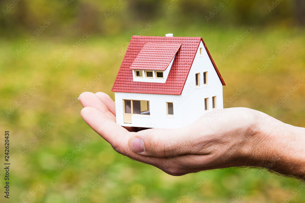 Home for you concept, house in hand Home for you concept, house in hand