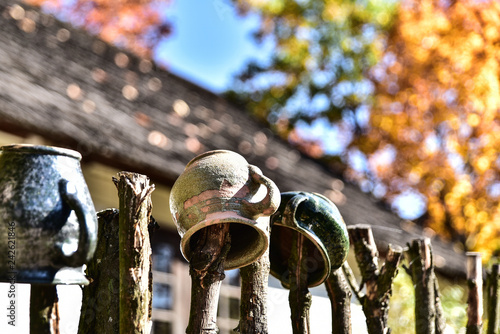 Clay pots hanging on the fence