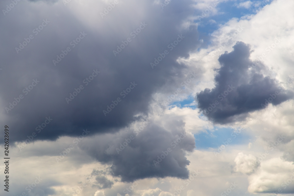 Fototapeta premium Clouds after rain before sunset as a background