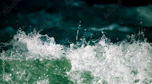 Splashes of water from the waves in the sea © schankz