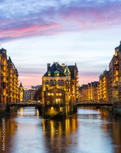 Hamburg Speicherstadt (warehouse district) in the evening, colorful with Watercastle (Wasserschloss)