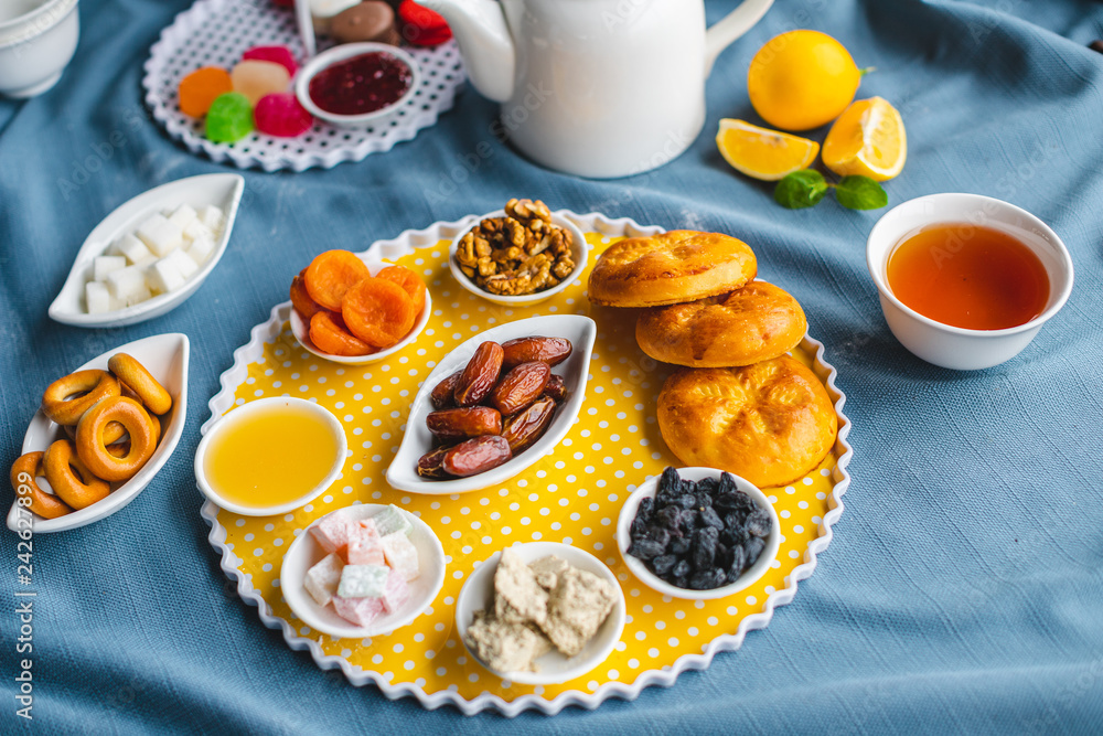 tea drinking, breakfast, tea with muffins and dried fruit tea drinking, breakfast, tea with muffins and dried fruit