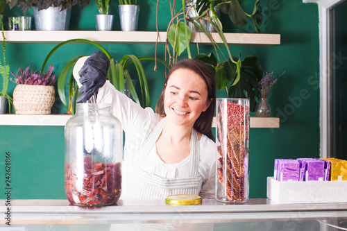 Woman seller show the pastila in the raw shop photo