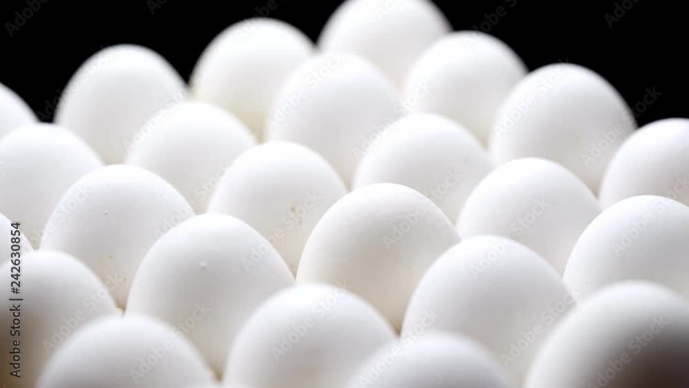 Close-up of packed chicken eggs. White eggs in carton box. Close-up of packed chicken eggs. White eggs in carton box.