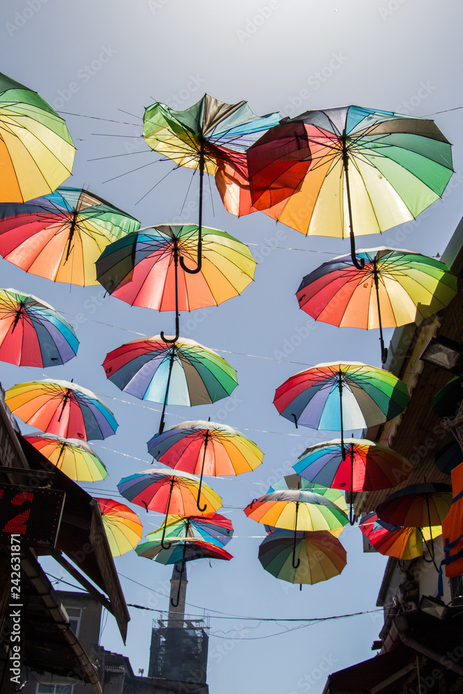 Colored umbrellas hanging above the street