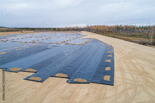 the construction of the landfill and installation of geomembrane photo