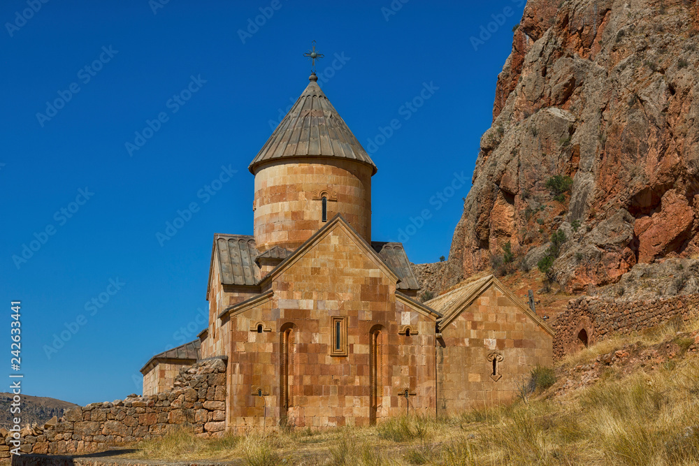 Noravank monastery complex built on ledge of narrow gorge. Tourist and historical place. Armenia