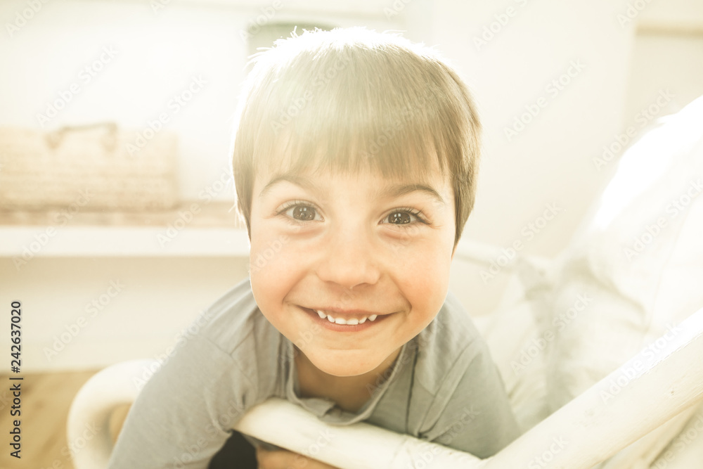 Portrait of a smiling and happy child at home. Child with joyful expression Portrait of a smiling and happy child at home. Child with joyful expression