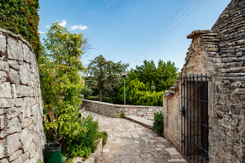 Brick roofs trulli in Alberobello. Puglia Italy on a sunny day. UNESCO Cultural Heritage List photo