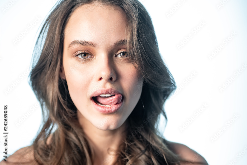 The girl tongue licks her upper lip The girl tongue licks her upper lip