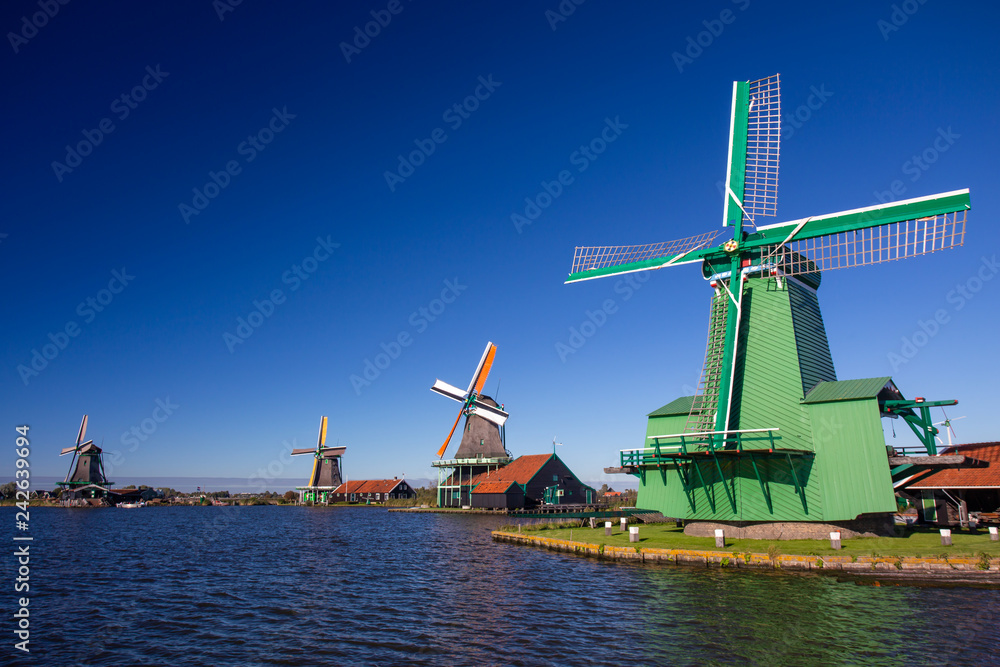 Close view on Windmills. Zaanse Schans Windmills and famous Netherlands canals, Europe.