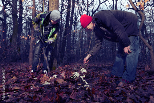 Couple of father and son found human skeleton when walking in winter forest