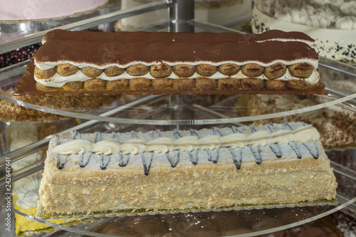 Several Types of Stuffed Cakes inside a Pastry Display Stand