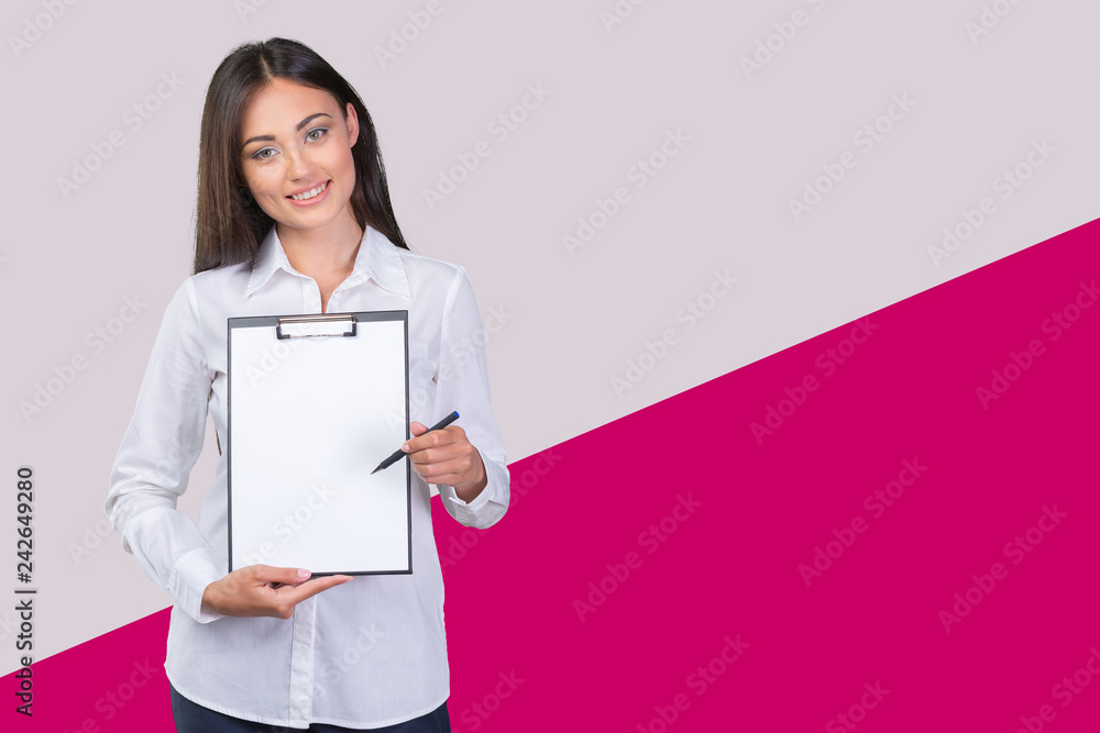 Young business woman standing with her clipboard Young business woman standing with her clipboard