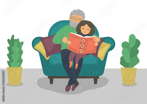 Grandpa and granddaughter reading book. 