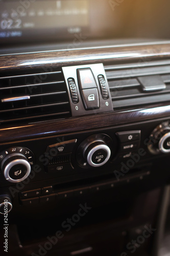 Air conditioning button inside a car. Climate control AC unit in the new car. Modern car interior details.