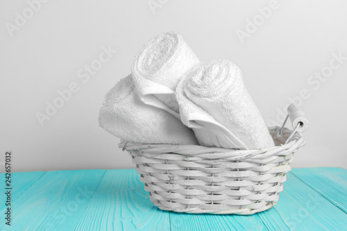 Clean soft towels on wooden table