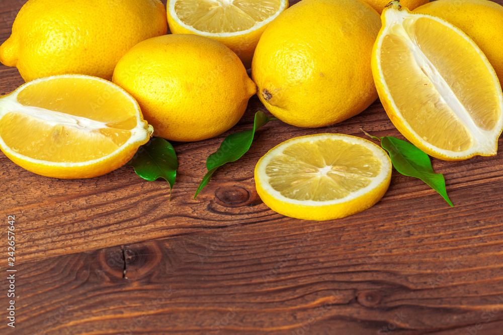 Pile of lemons on wooden table Pile of lemons on wooden table