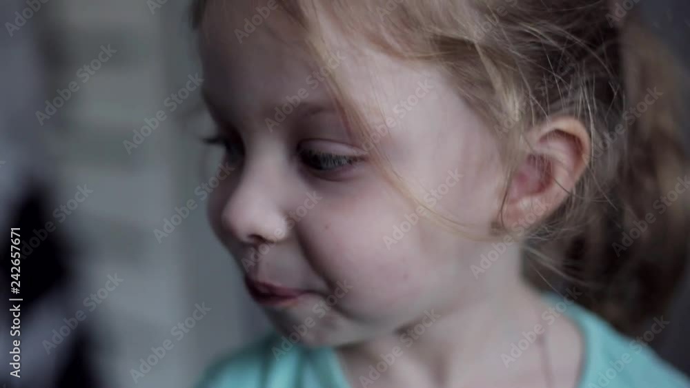 close-up portrait of Caucasian cheerful little girl with blue eyes close-up portrait of Caucasian cheerful little girl with blue eyes