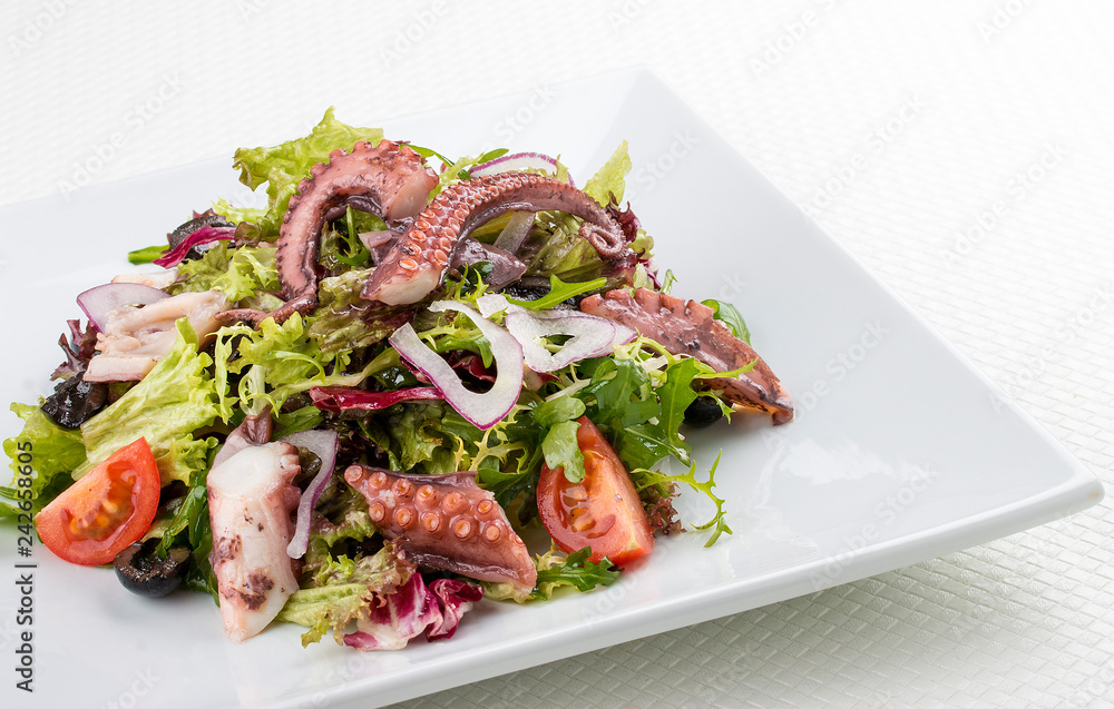 Salad with squid and octopus on a white background Salad with squid and octopus on a white background
