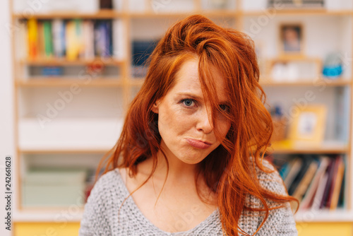 Pretty red-haired woman making funny face