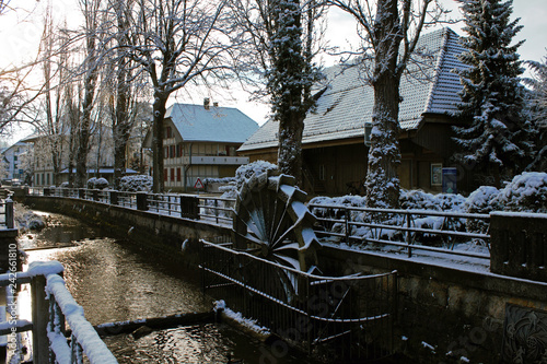 snow covered water mill in the center of Lyss, Switzerland. photo