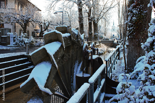 Close-up of the water mill in the Lyssbach brook at the center of Lyss, Swiss city.