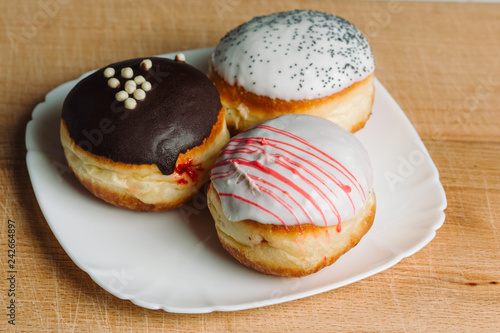 German donuts - Three donuts with different icing.