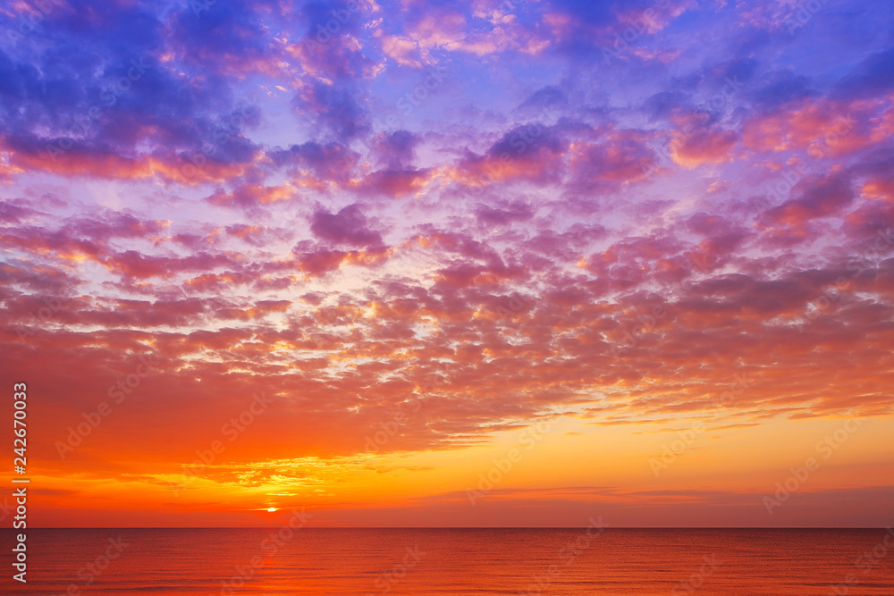 Beautiful, orange-pink sunset over the sea. Background image.