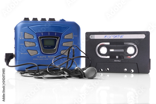 old-fashioned music cassette and walkman player with earphones photo