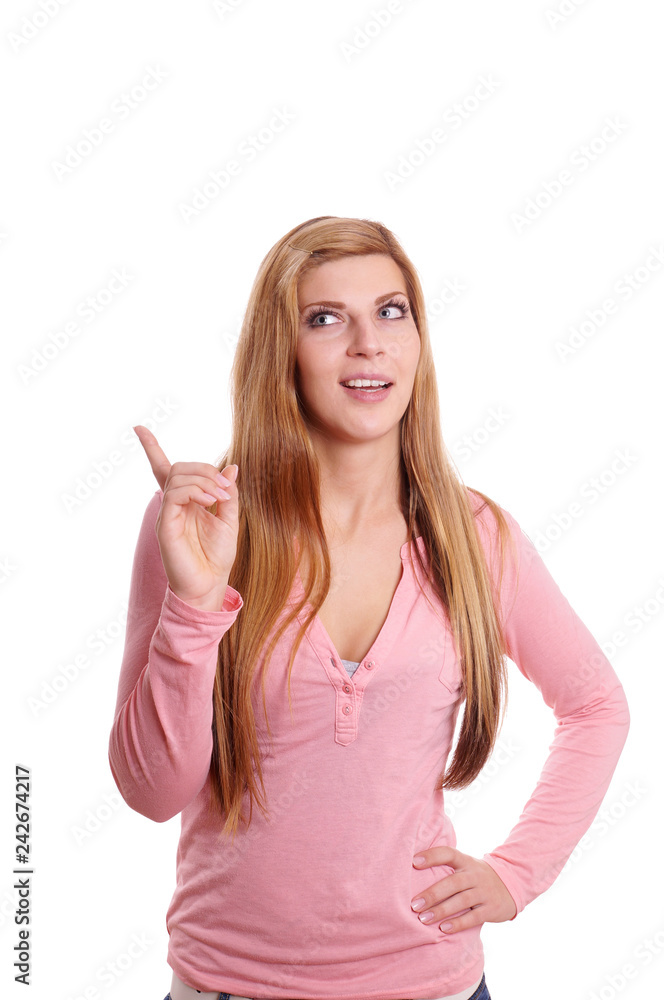 young woman having an idea looking and pointing to copy space young woman having an idea looking and pointing to copy space