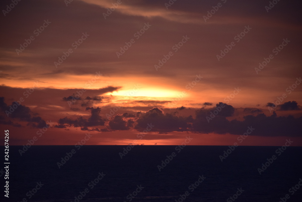 Orange sunset covered sun