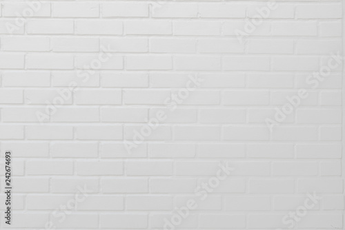 Abstract weathered modern white bricks wall background stucco in rural room . The brick work from stone tile which its was from modern paint technology.