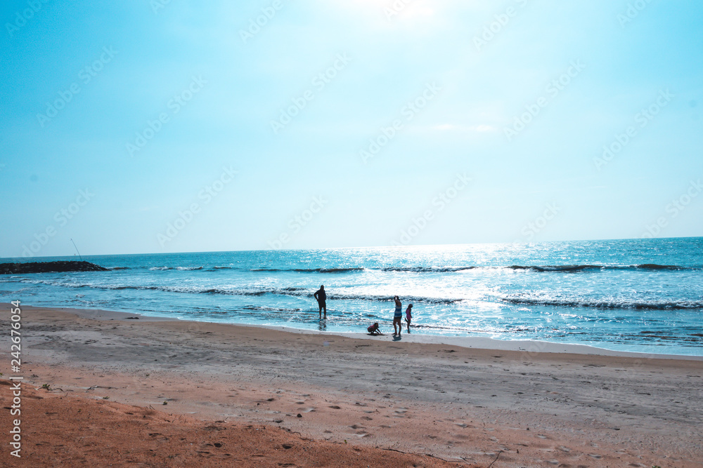 family walk in the Beach and tropical sea in Sri lanka