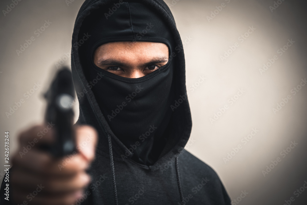 A man holding a gun in hand, the ship ready to shoot the man pointed a gun at us. A man holding a gun was robbed. A man holding a gun in hand, the ship ready to shoot the man pointed a gun at us. A man holding a gun was robbed.