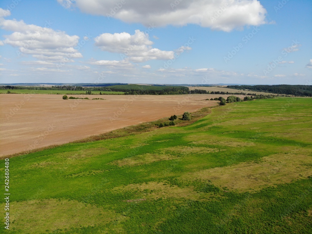 Top view of the fields and harvest. Shooting from the quadcopter. sunny day