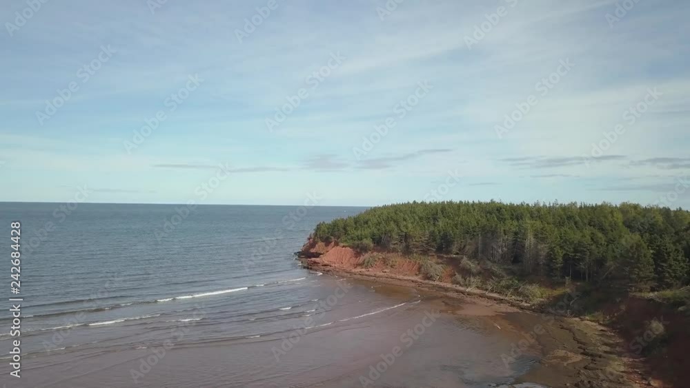 Aerial view of a beautiful rocky shore on the Atlantic Ocean. Taken in Cabot Beach Provincial Park, Prince Edward Island, Canada. Aerial view of a beautiful rocky shore on the Atlantic Ocean. Taken in Cabot Beach Provincial Park, Prince Edward Island, Canada.