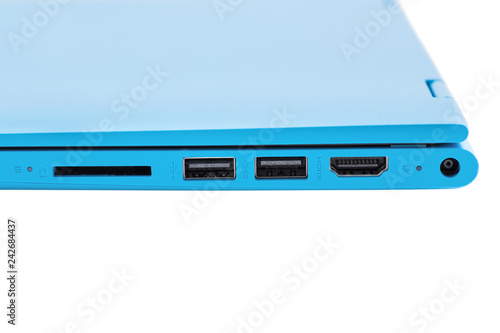 Part of the modern blue laptop with a power button, USB connector, headphone jack and volume buttons