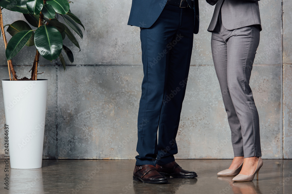 cropped view of businesspeople in formal wear in office cropped view of businesspeople in formal wear in office