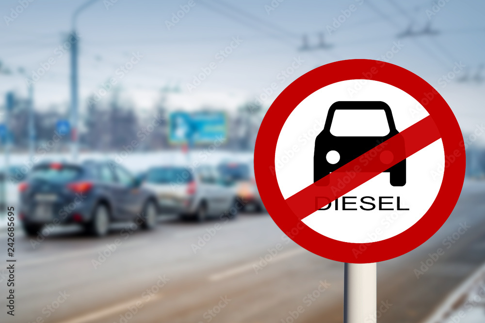 Diesel Prohibition ban on the movement of cars with diesel fuel Euro3, Street with transport in the blur and road sign close up Diesel Prohibition ban on the movement of cars with diesel fuel Euro3, Street with transport in the blur and road sign close up